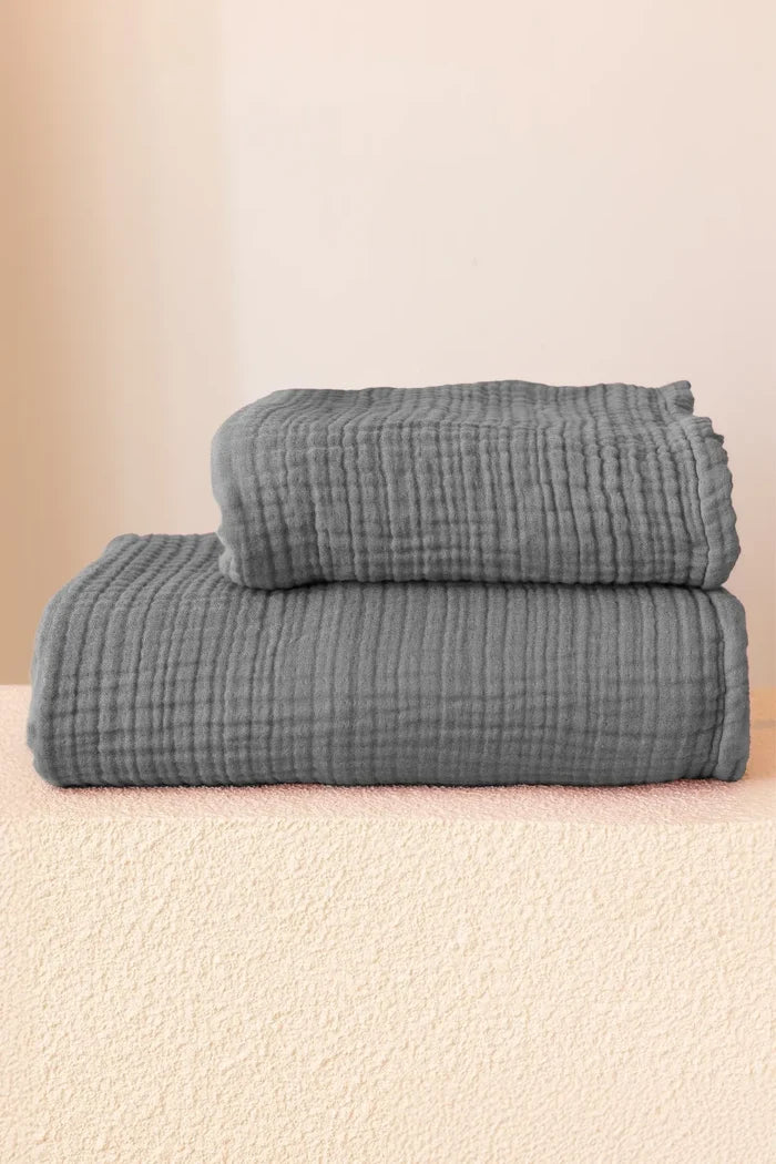 Anthracite handwoven muslin towel in a styled bathroom setting, OEKO-TEX certified VivaMaison Turkish cotton