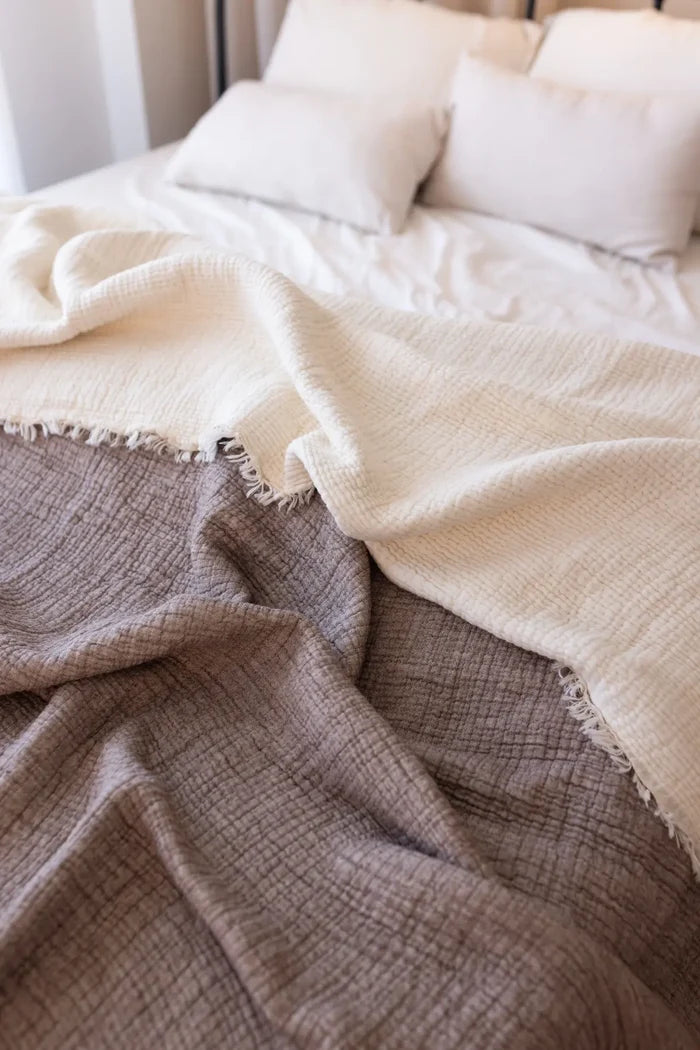 Dark Brown handwoven 8-layer muslin Turkish cotton quilt folded flat lay. Hand-tied fringe Denizli, OEKO-TEX. Vivamaison.