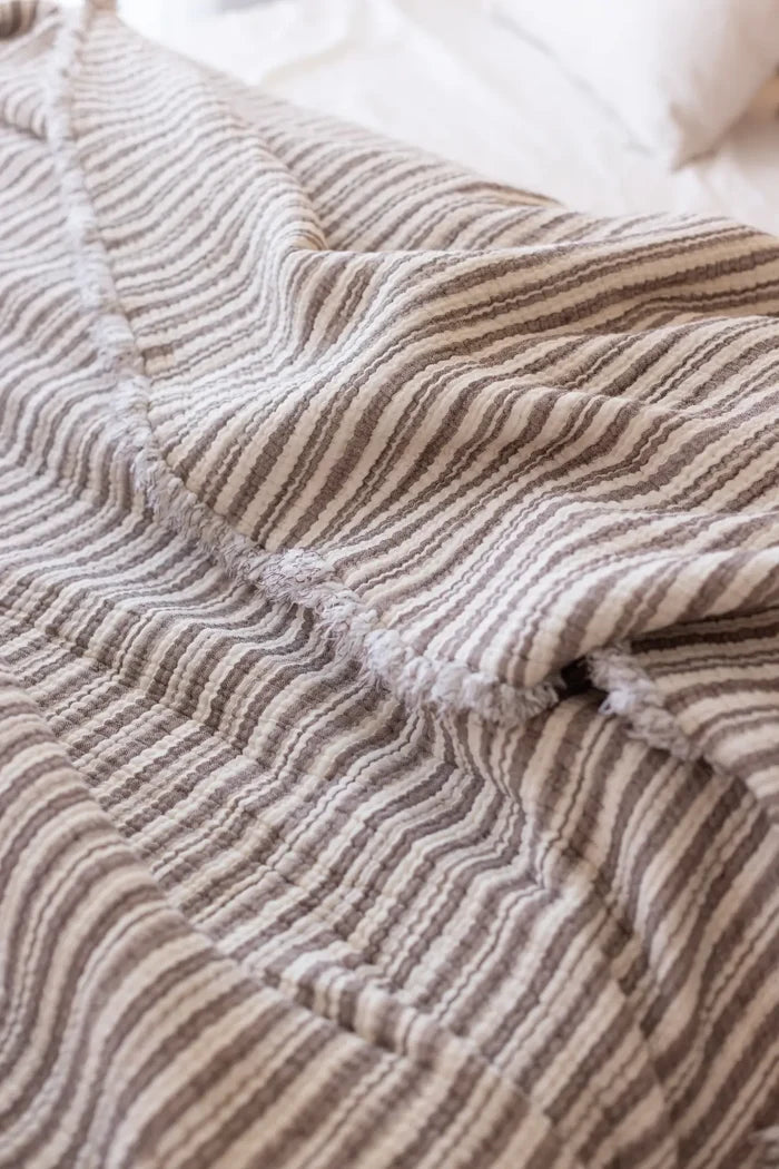 Dark Brown Striped handwoven 8-layer muslin Turkish cotton quilt folded flat lay. Hand-tied fringe Denizli, OEKO-TEX. Vivamai