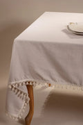 Beige handwoven solid color Turkish cotton tassel tablecloth table setting. Tasseled edges Denizli, OEKO-TEX. Vivamaison.