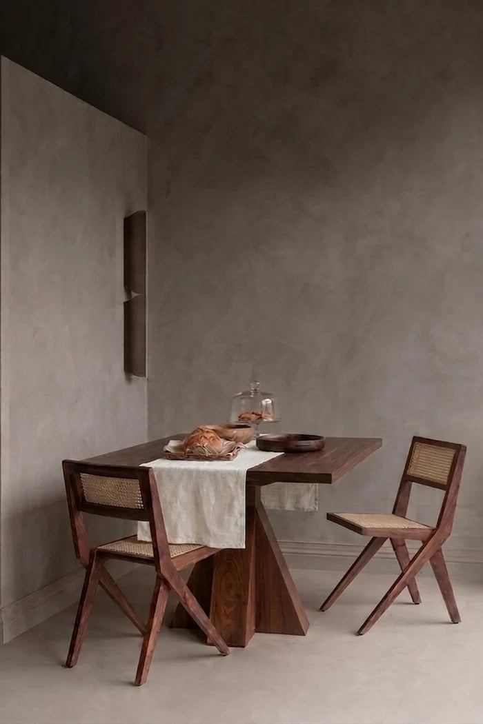 White plain linen cotton blend table runner styled in a modern dining room with cane chairs. 16 x 51 in, handmade in Denizli, OEKO-TEX. VivaMaison.