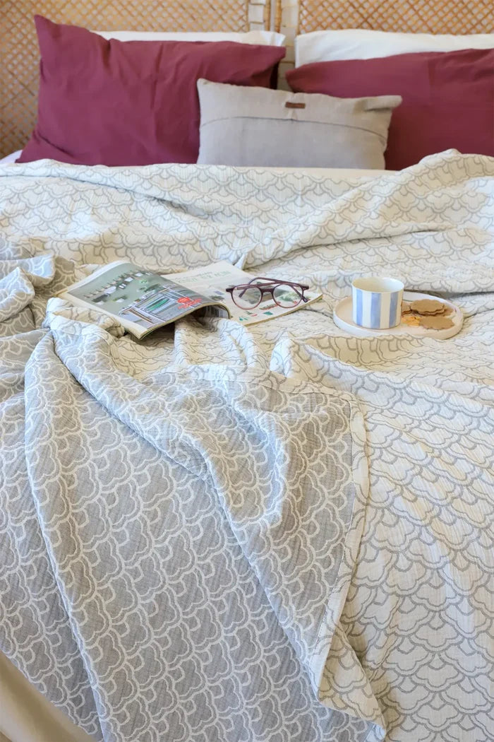Cotton handwoven 3-layer muslin Turkish cotton bedspread folded flat lay. Woven patterns, Denizli, OEKO-TEX. Vivamaison.